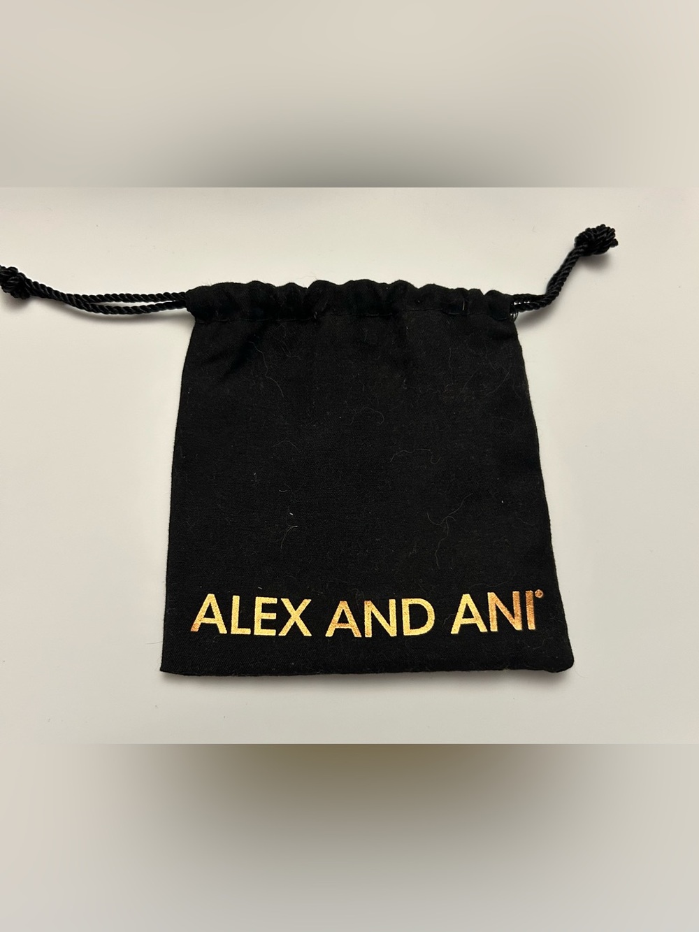 Alex and Ani Black and Gold Logo Drawstring Pouch
